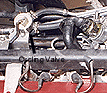 Cycling valve showing three ports: inlet side connection, compressor discharge connection, and wastegate diaphragm line